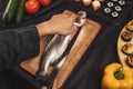 Chef cleaning the fish for dish Royalty Free Stock Photo