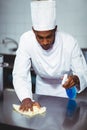 Chef cleaning kitchen counter Royalty Free Stock Photo