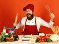 Chef cook in commercial kitchen. Professional chef holds rolling pin Royalty Free Stock Photo