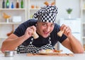 Chef cook cooking a meal breakfast dinner in the kitchen Royalty Free Stock Photo