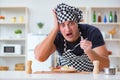 The chef cook cooking a meal breakfast dinner in the kitchen Royalty Free Stock Photo