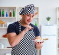 Chef cook cooking a meal breakfast dinner in the kitchen Royalty Free Stock Photo