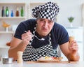 Chef cook cooking a meal breakfast dinner in the kitchen Royalty Free Stock Photo