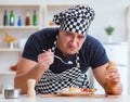 Chef cook cooking a meal breakfast dinner in the kitchen Royalty Free Stock Photo