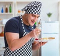 Chef cook cooking a meal breakfast dinner in the kitchen Royalty Free Stock Photo