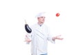 Chef or cook juggling with vegetables an eggpland and tomato Royalty Free Stock Photo