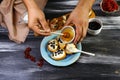 The chef cook prepares sweet berry crostini sandwiches with cream cheese ricotta, blueberries and honey on the whole grain bread b Royalty Free Stock Photo