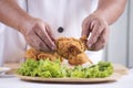 Chef cook preparing fried chicken