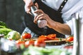 Chef prepares vegetables to cook in the restaurant kitchen Royalty Free Stock Photo