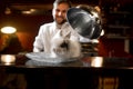 Chef cook serving alive rabbit
