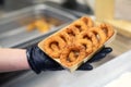 Chef or cook serving battered fried onion rings Royalty Free Stock Photo