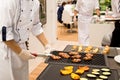 Chef cooked meat steaks on the grill Royalty Free Stock Photo