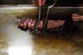 Chef cooking beef in Japanese teppanyaki