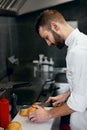 Chef Cooking Burgers in Kitchen Royalty Free Stock Photo