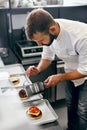 Chef Cooking Burgers in Kitchen Royalty Free Stock Photo