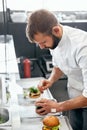 Chef Cooking Burgers in Kitchen Royalty Free Stock Photo