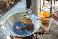 Chef cooking deep-fried fish in the big pan to Chinese banquet food preparation. fat from trans-fat concept. disease from choleste