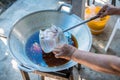 Chef cooking deep-fried fish in the big pan to Chinese banquet food preparation. fat from trans-fat concept. disease from choleste