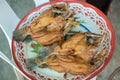 chef cooking deep-fried fish in the big pan to Chinese banquet food preparation. fat from trans-fat concept. disease from choleste