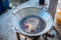 Chef cooking deep-fried fish in the big pan to Chinese banquet food preparation. fat from trans-fat concept. disease from choleste