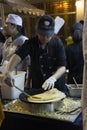 Chef cooking a delicious crepes at street food market festival on tunjungan street