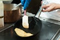 Chef cooking egg omelet in the pan at restaurant. Royalty Free Stock Photo