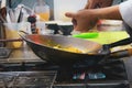 Chef cooking with flame in a frying pan on a kitchen stove, Chef Royalty Free Stock Photo