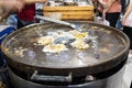 Chef cooking food fry Pan-fried crispy mussel at Street food at Yoawaraj Road Royalty Free Stock Photo