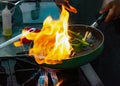 Chef cooking food in the kitchen, stir fried vegetables in the pan Royalty Free Stock Photo