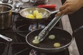 Chef cooking food in the kitchen, stir fried vegetables in the pan Royalty Free Stock Photo