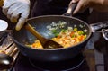 Chef cooking food in the kitchen, stir fried vegetables in the pan Royalty Free Stock Photo