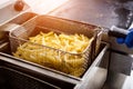 The chef cooking french fries. Restaurant.