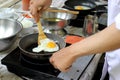 Chef cooking fried eggs