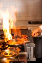 Chef cooking in kitchen stove Royalty Free Stock Photo