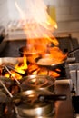 Chef cooking in kitchen stove Royalty Free Stock Photo