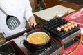 A chef is cooking an omelet Royalty Free Stock Photo