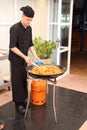 Chef cooking paella