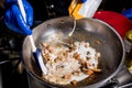 Chef cooking pasta with mussels in pan. Italian style cuisine. Restaurant. Royalty Free Stock Photo