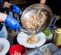 Chef cooking pasta with mussels in pan. Italian style cuisine. Restaurant. Royalty Free Stock Photo