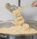 Chef cooking rice in a commercial kitchen Royalty Free Stock Photo