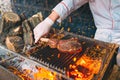 Chef Cooking steak. Cook turns the meat on the fire.