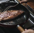 A chef cooking steak in a pan food photography recipe idea