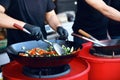 Chef Cooking Thai Dish Closeup At Street Food Festival. Royalty Free Stock Photo