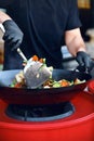 Chef Cooking Thai Dish Closeup At Street Food Festival. Royalty Free Stock Photo