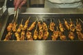 Chef cooks skewer of turkey or chicken meat shish kebab