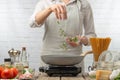 Chef cooks in a skillet, fry, tosses greens Freeze in motion Recipes, illustrations for cooking books or magazines Royalty Free Stock Photo