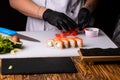 Chef cooks sushi in stages