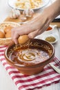 Chef cracking an egg on a garlic soup Royalty Free Stock Photo