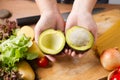 Chef cut avocado prepare for make a vegetable salad. Royalty Free Stock Photo