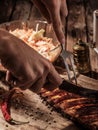 Chef cut up barbecue ribs. Royalty Free Stock Photo